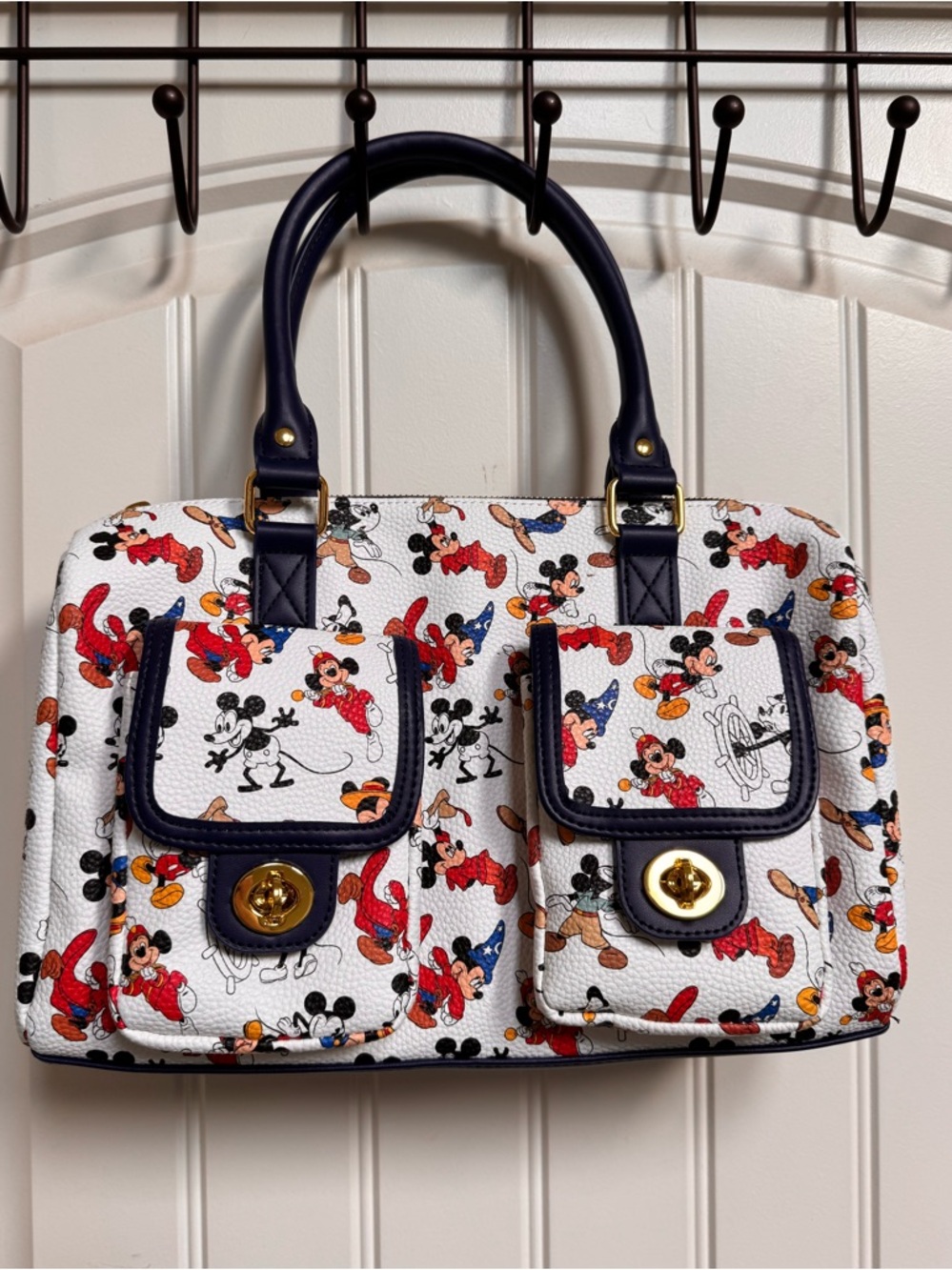Disney Parks Mickey Mouse Through the Years Turnlock Hand Bag. 12.5” by 9” by 4”